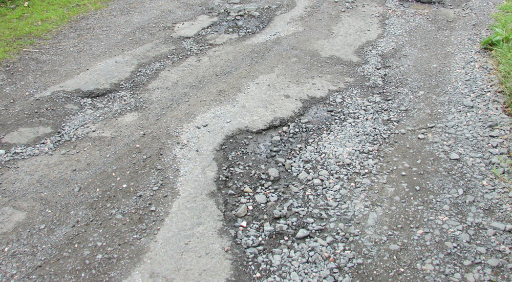 asphalt repair needed, destroyed driveway