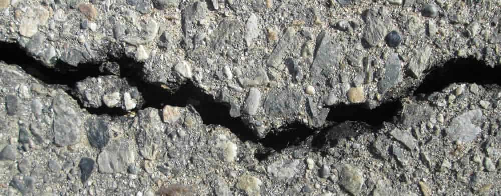 Cracked Asphalt needs repair for winter snow removal services