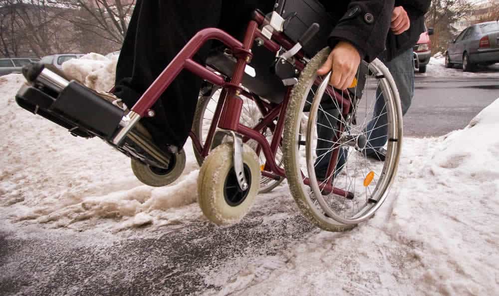 ada compliant snow removal - wheelchair on snow